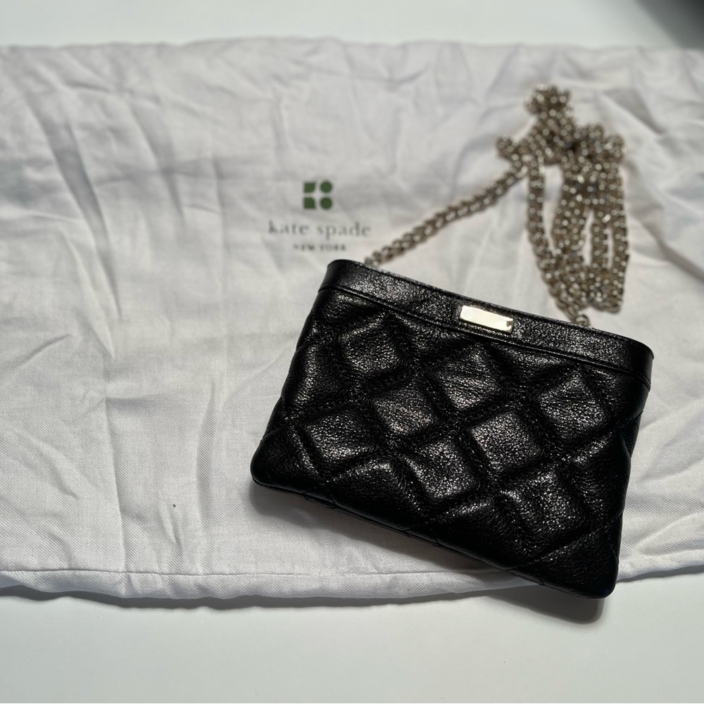 New with tags black Kate Spade small shoulder/crossbody.  Dust bag included.